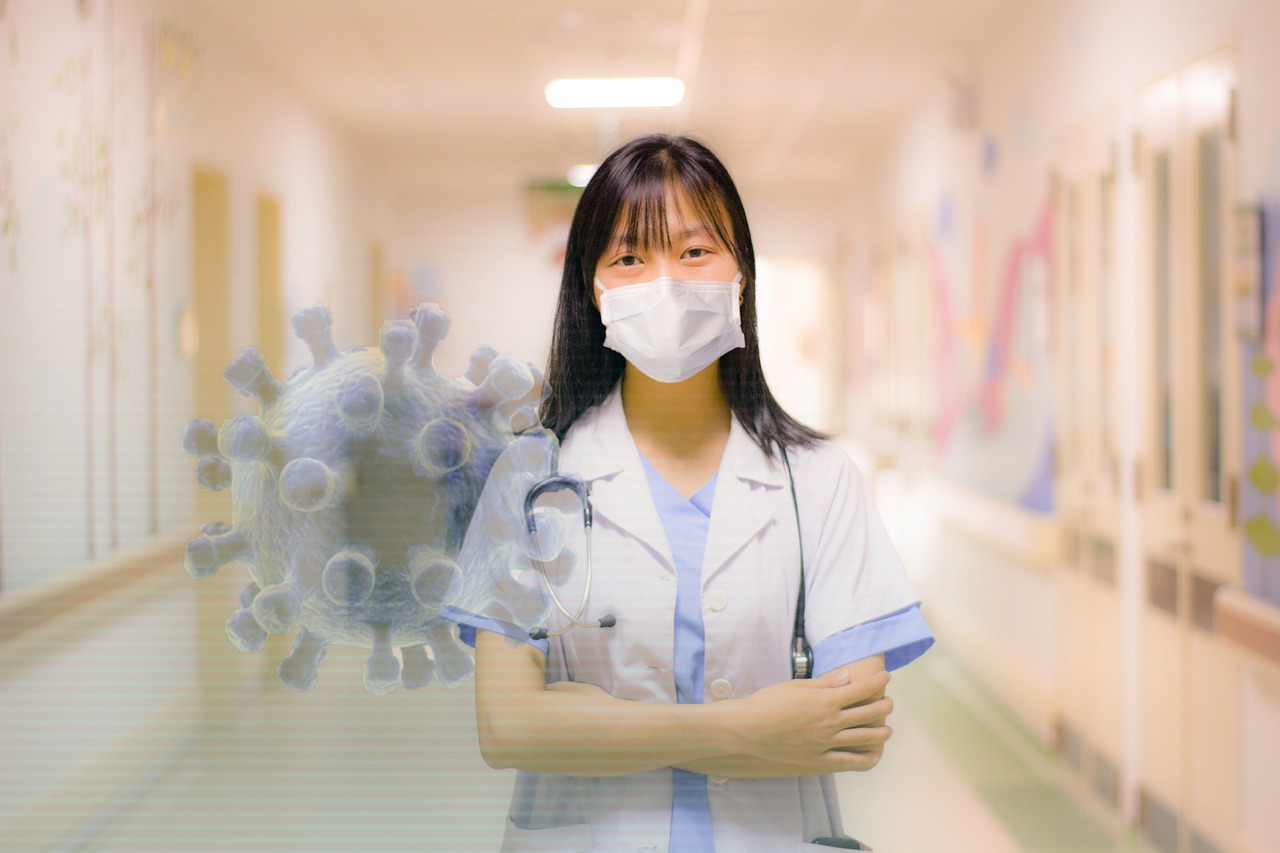Lady in doctor's uniform wearing mask in hospital
